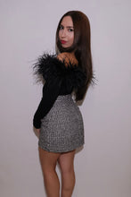  Back and side view of a black off-the-shoulder ostrich feather trim top showing the fitted long sleeves and dramatic feather detailing across the shoulders