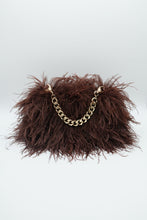 Brown feather handbag with gold chain handle on white background